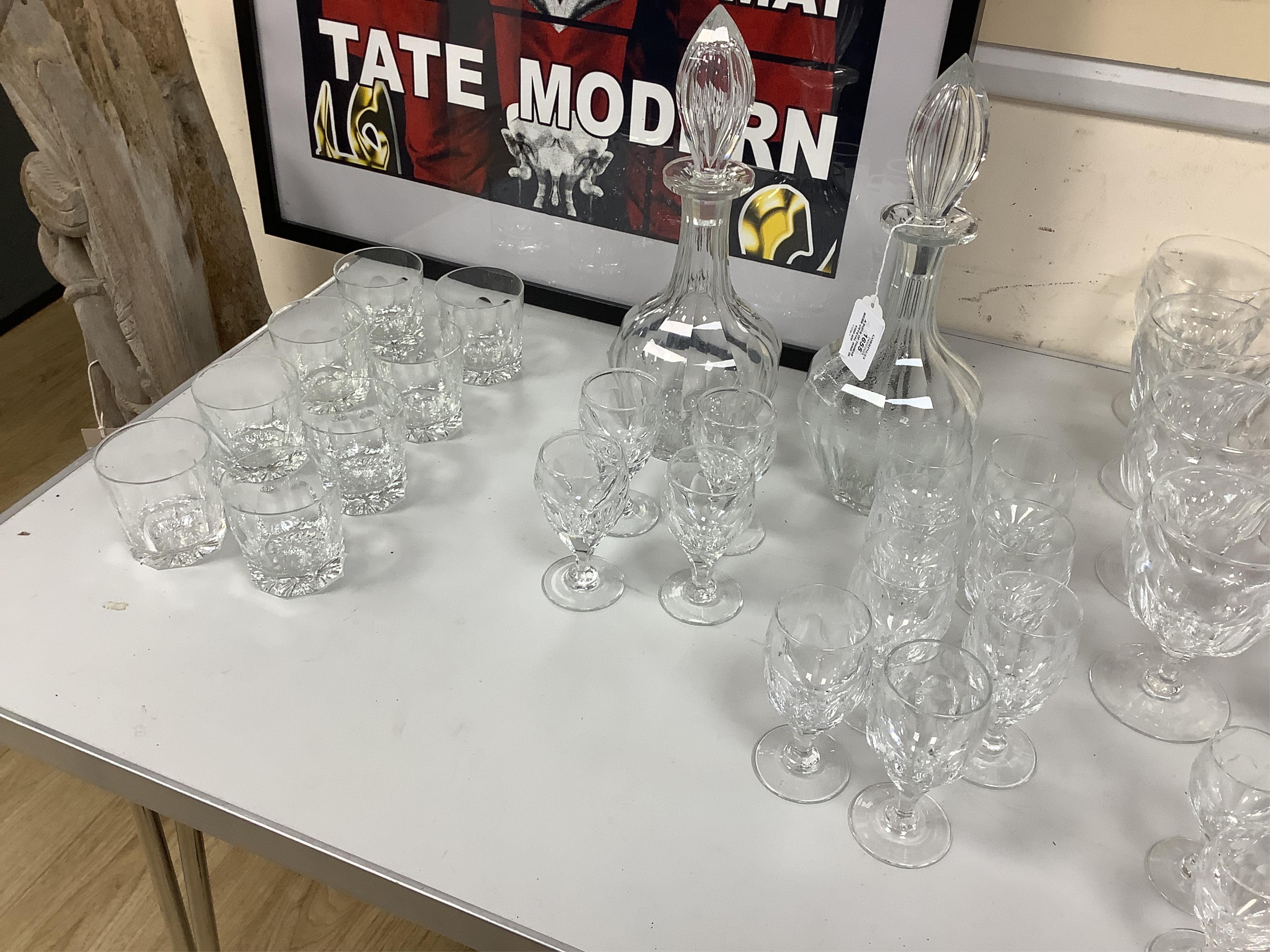 A suite of Thomas Webb Crystal wine glasses, Royal Yacht pattern, including two decanters, eight goblets, white wines and clarets, sixty-four pieces. Condition - mostly good